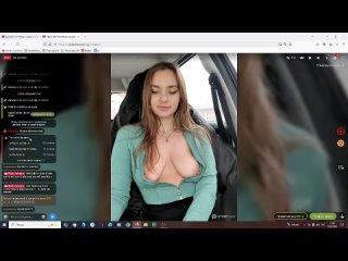 a whore with bare tits in the car showed a pussy and a point